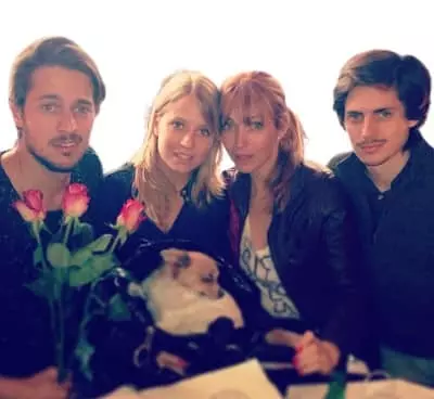Lucas Bravo with his mother and siblings