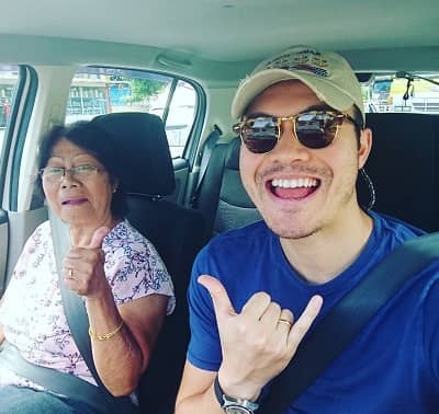 Henry Golding with his mother Margaret Likan Golding