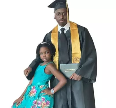 Genesis White with her brother