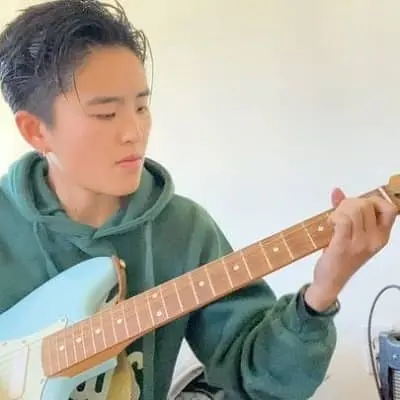 Terry Hu playing guitar