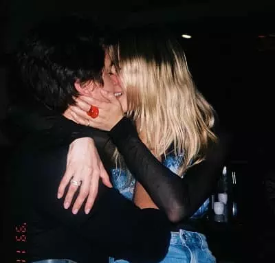 Ari Fournier kissing her boyfriend Cole Sprouse