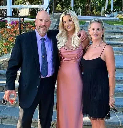 Emma Hernan with her father and mother