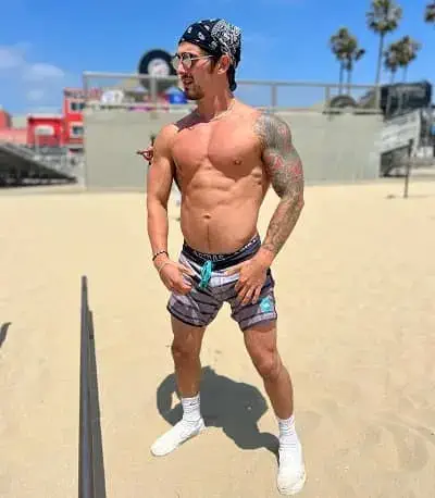 Jason Cohen showing his muscles