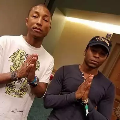 Malcolm Mays with Pharrell Williams