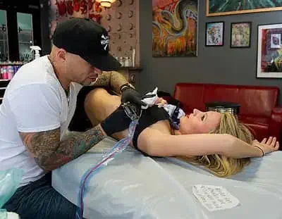 Ami James making tattoo on Camilla Romestrand