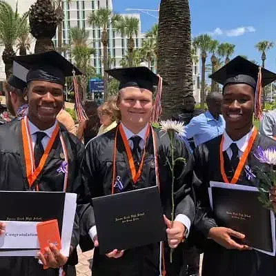 Deyon Miller with his friends on graduation day