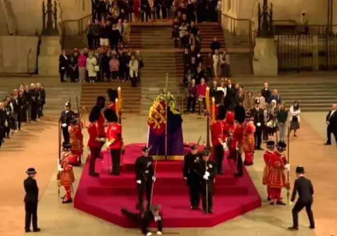 Royal Guard Fall Down Near Queen Elizabeth II's Coffin
