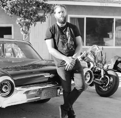 Chris Rutkowski with his car and bike