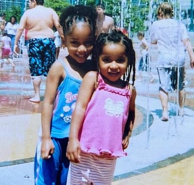 Iman Benson with her sister suhiallah in childhood