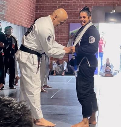 Kim Congdon receiving blue belt for Karate