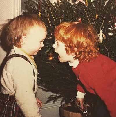 Emily Beecham childhood photo (right) with her brother (left)