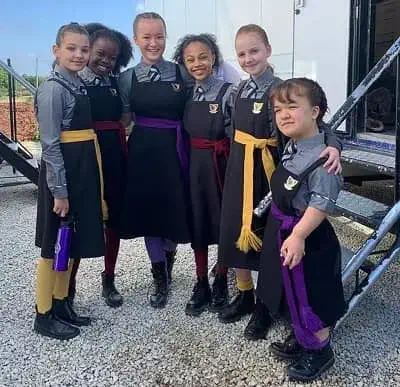 Billie Boullet with The Worst Witch cast
