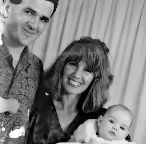 Monika Clarke childhood photo with her parents