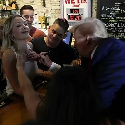 Donald Trump giving autograph to Ashley Rashid