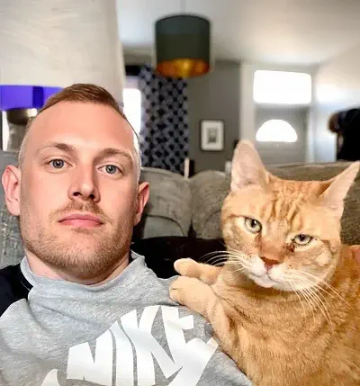 Journalist Josh Kruger with his Cat